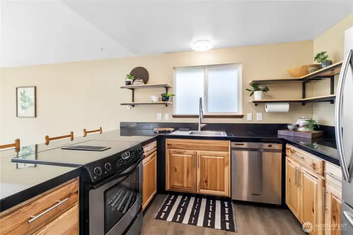 Newly renovated kitchen w/ beautiful hard wood cabinets.