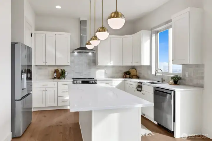 Quartz countertops, custom cabinetry, high-end stainless steel appliances