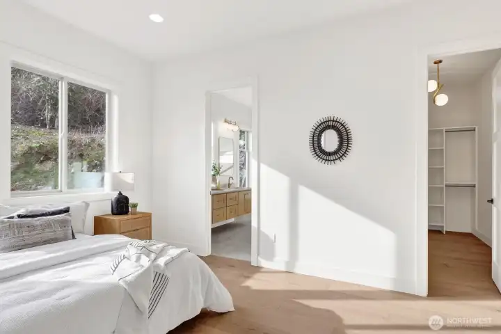 The primary suite has a large walk-in closet and the best spa-like bathroom