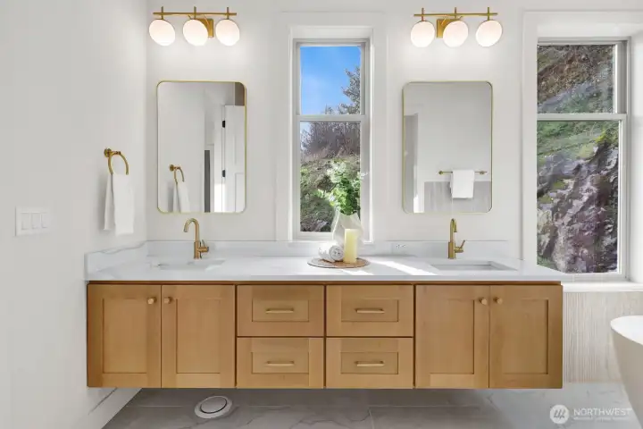 Double sinks with so much space. Note the custom floating cabinetry