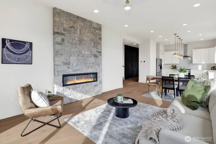 The great room is open to the hallway from the front entry