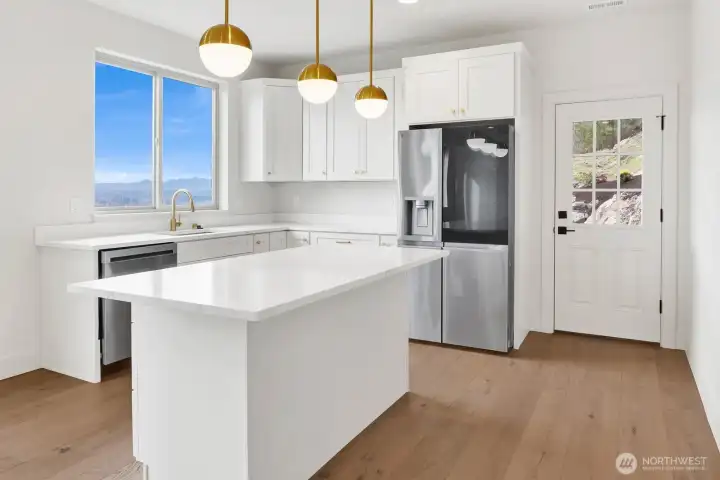 Note the kitchen downstairs (plumbed for a stove) and the man door with access to the back yard