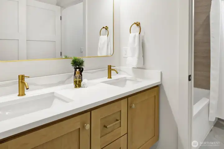 The downstairs bathroom is spacious and features the same beautiful finishes as the rest of the home