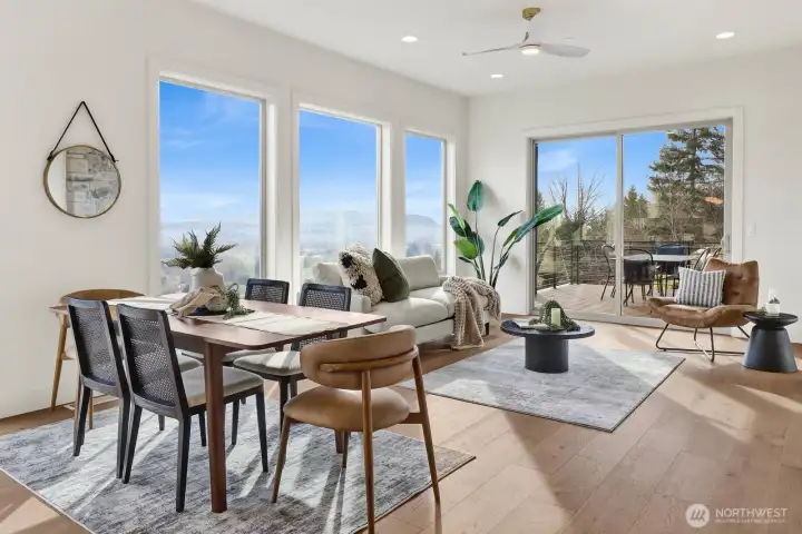 The view from the kitchen of the dining room and great room...note the access to the deck