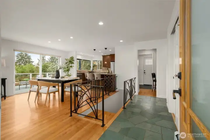 Upon entering, you are immediately welcomed into this beautifully remodeled home with a fabulous circular layout making entertaining a breeze! Straight ahead you'll see a door that leads to wrap around deck and quick access to BBQ.