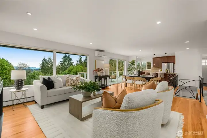 View of your Kitchen/Great Room with stunning views from the entire back of the home- especially beautiful morning sunrises!