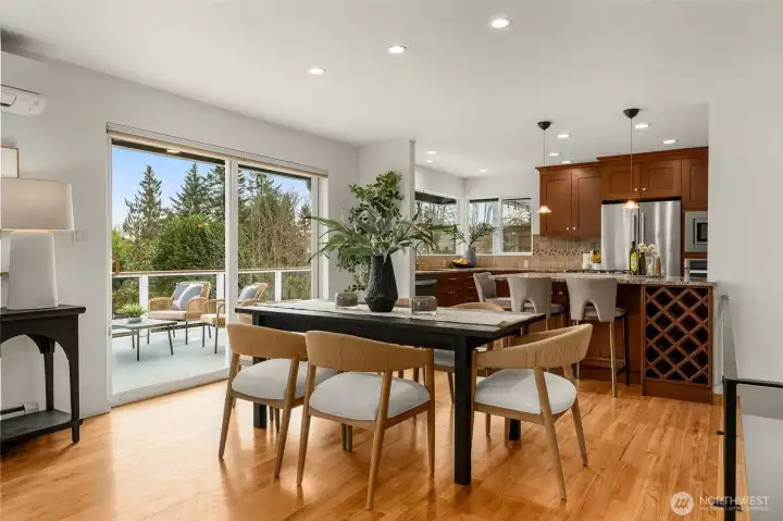 Dining area is roomy enough for a large table- access to the oversized deck offers a wonderful setting for entertaining.
