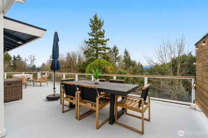Another view of your outdoor Living and Dining Rooms, overlooking the sport court, garden, and backyard.