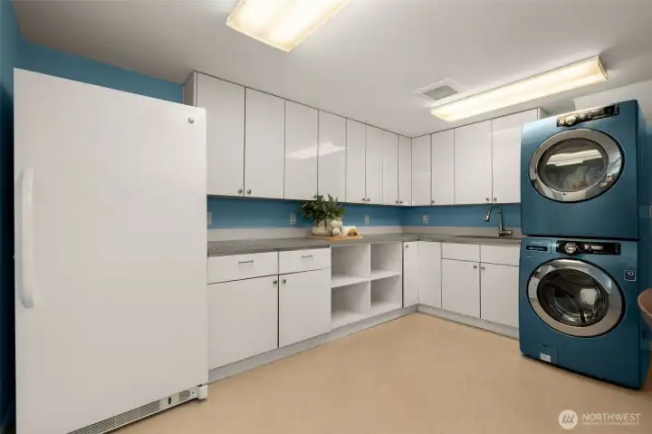 Down the hall from the Media Room is a very large Utility Room- great place for messy projects. Freezer and Washer/Dryer stay- this home is so move-in-ready! There's also a door to the Mechanical Room from here, where's there's additional storage space.