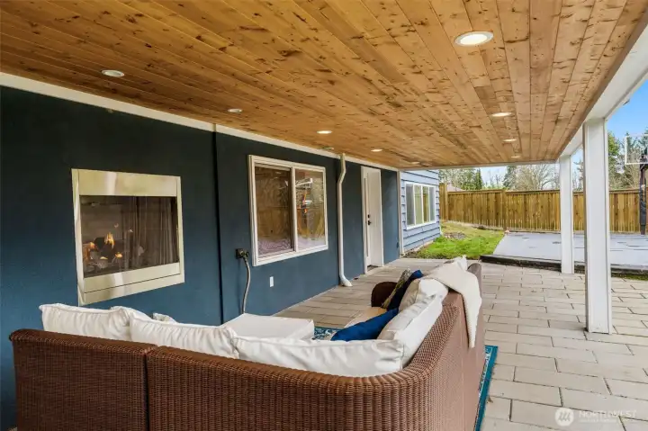 Covered Patio with your third(!) gas fireplace. There's also a very large storage room behind the fireplace- door is to the left, out of view in the photo.
