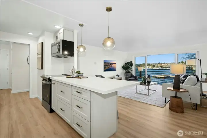 New cabinets, new appliances, new quartz countertops, new sink, new lighting, and new luxury vinyl plank flooring!