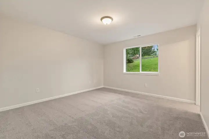 Primary Bedroom with private bathroom and walk-in closet.