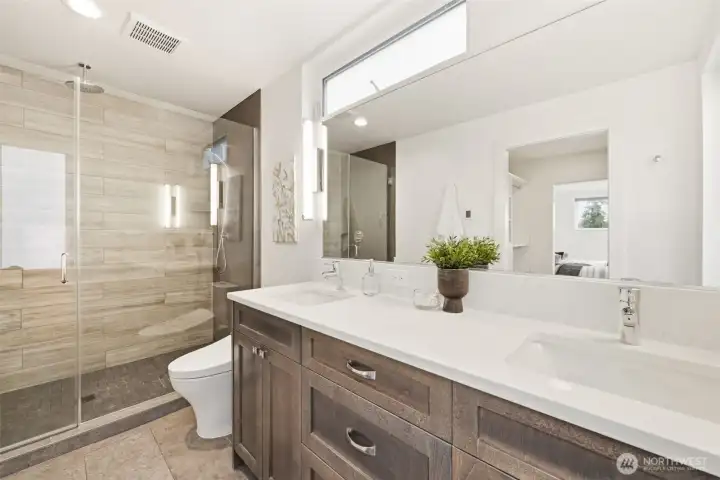 The primary bath with heated tile floors.