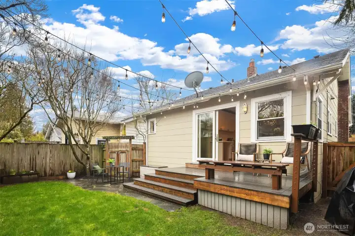 Level fenced yard with a sprinkler system makes yard maintenance easy.