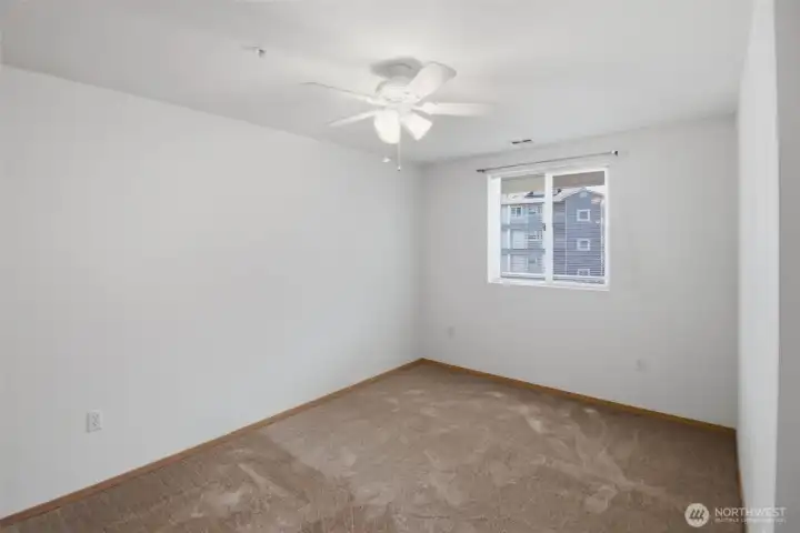 primary bedroom with new carpet and paint