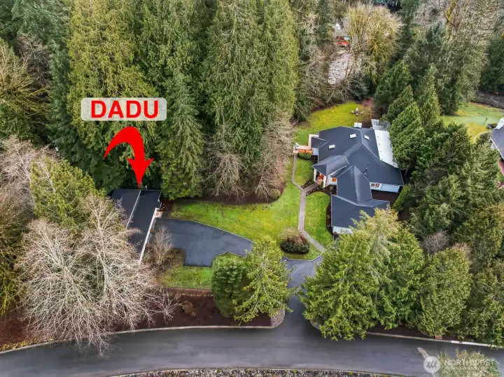 The 1.39 acre lot is lush and inviting with professional landscaping and sits above the scenic Raging River.
