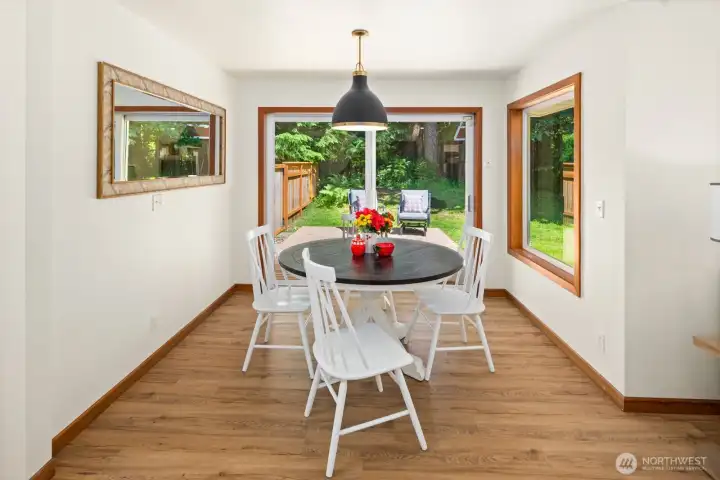 The breakfast nook opens to another relaxation area on the expansive deck!