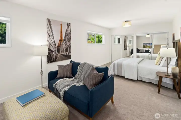 Large 2nd floor bedroom in the DADU with adorable lighting, a reading/TV area and tons of storage.
