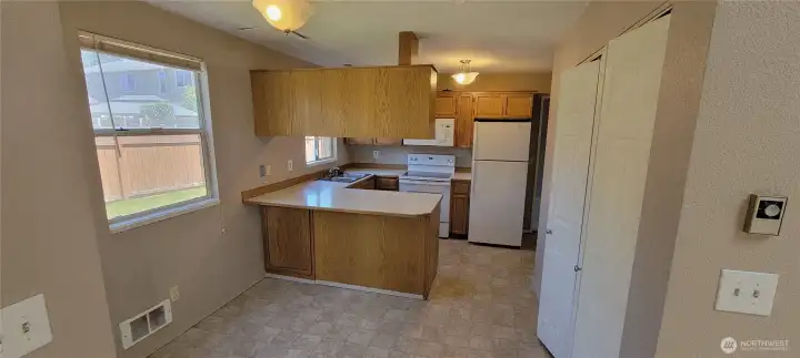 Kitchen with eat in space taken from the adjacent dining room.