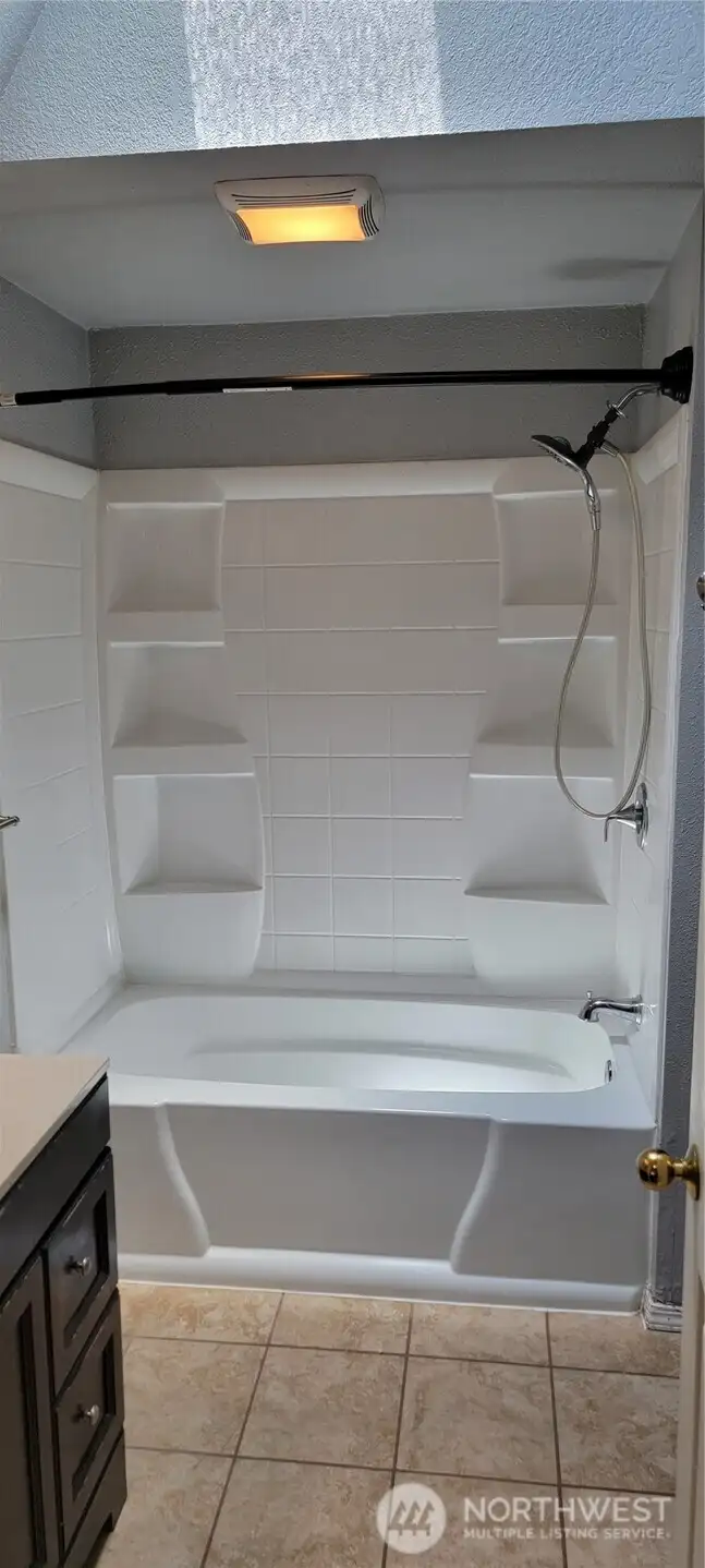 Upstairs bathroom shower/tub.