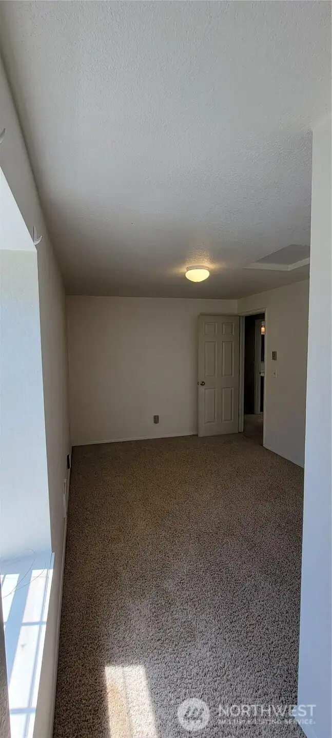 View from the otherside of the bedroom, notice the window seat.
