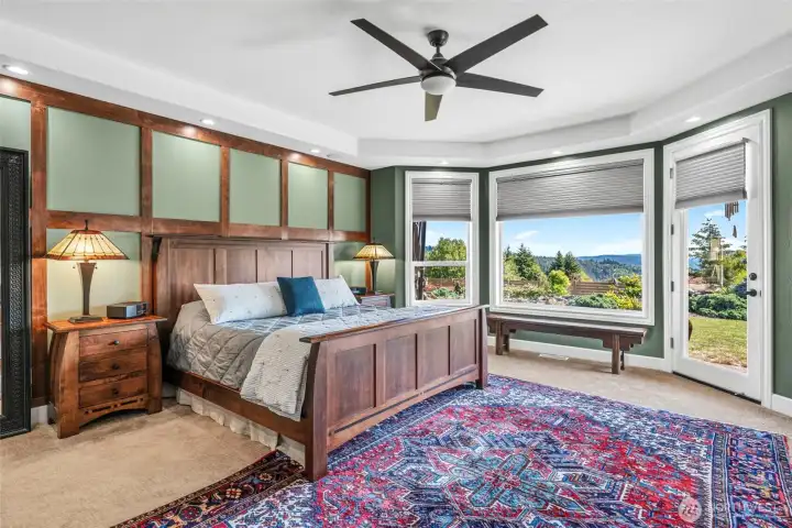 Primary bedroom with exterior access to the covered patio.