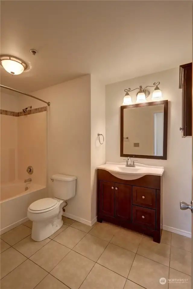 Remodeled bathroom with contemporary fixtures that elevate the aesthetic appeal while maximizing functionality.