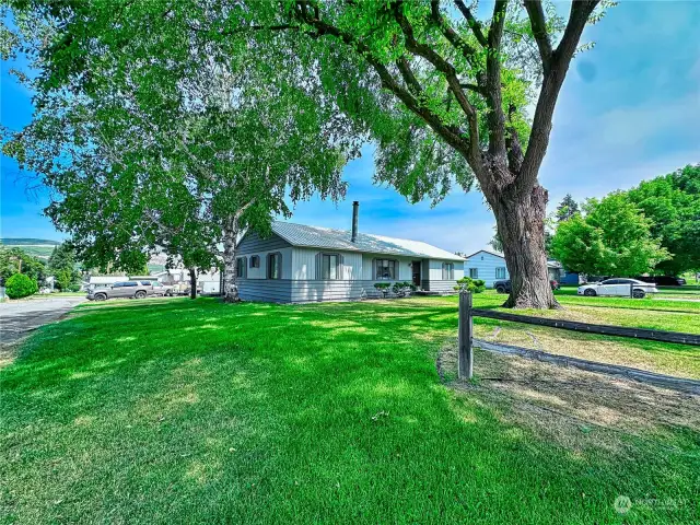 Located on well-manicured extra large corner lot