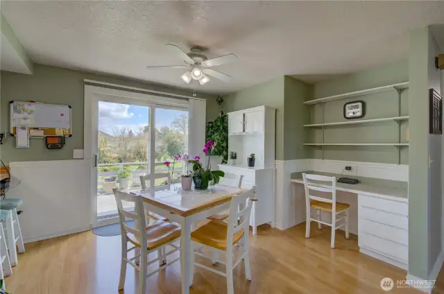 Dining room with easy access to the well landscaped fenced rear yard and deck.
