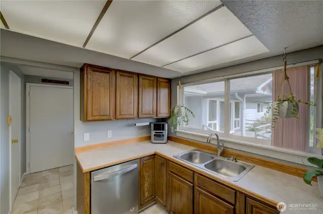 Looking through the kitchen through the Utility room, walk in pantry and garage.
