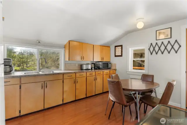 Eat-in kitchen with laminate flooring for easy care.