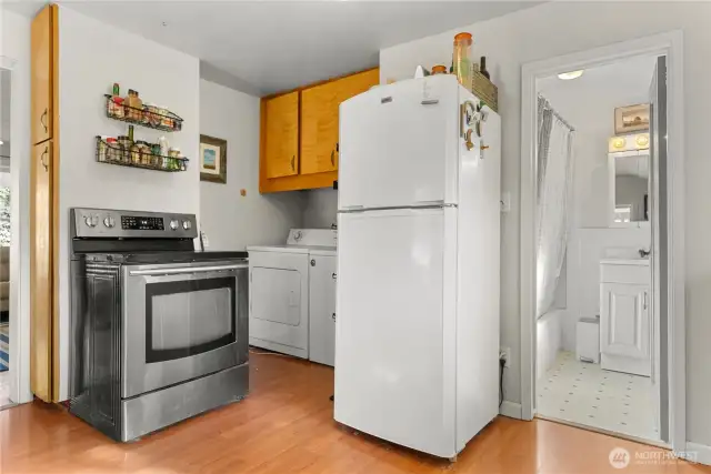 Laundry nook in kitchen plus door to the bathroom.