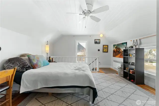 Walk-through room at the top of the stairs has many potential uses.