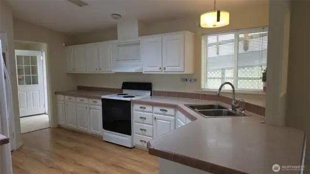 Bright sunny kitchen with lots of cabinets