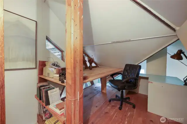 Sleeping loft doubled as office space.