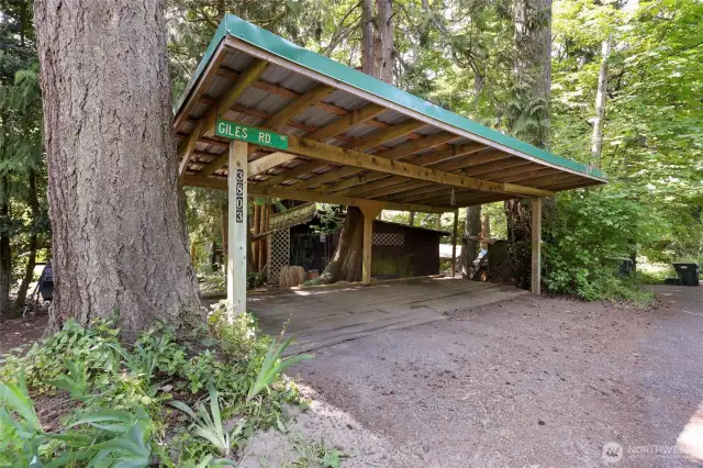 2 parking spaces under carport and additional one to the left.