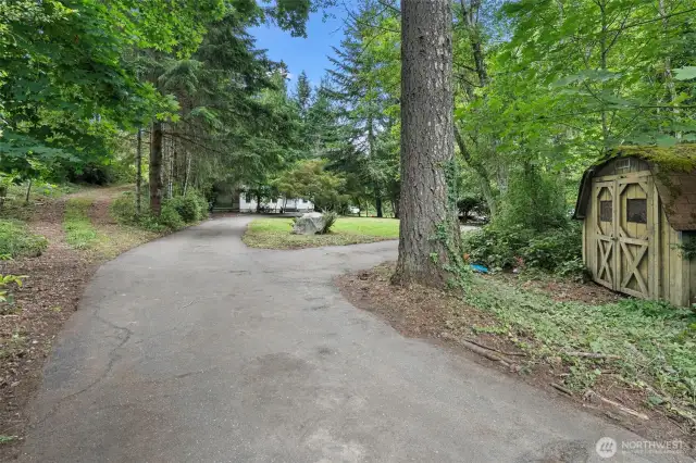 Enter the driveway and see the chicken coop/run area on right