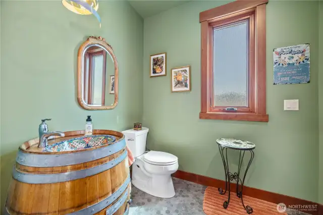 Half bath for guest on the main floor, doubles for pool changing room and enters from patio.