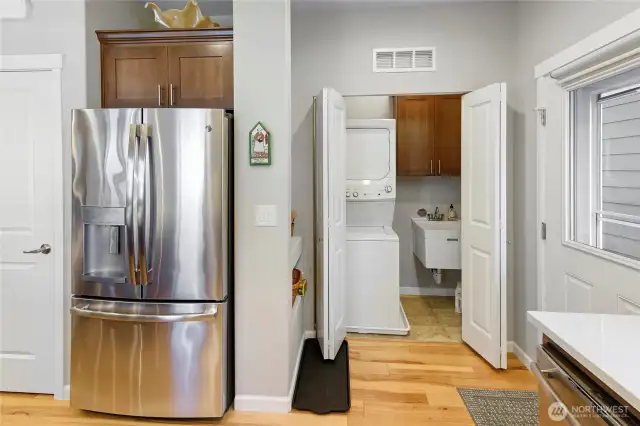 Laundry off the kitchen has a very useful utility sink.