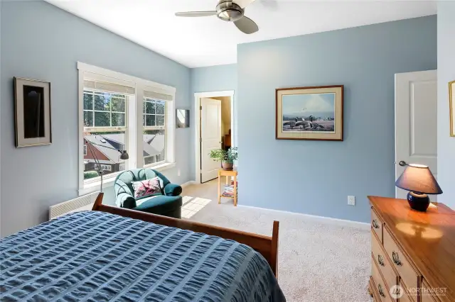 Guest bedroom with door to studio/den.