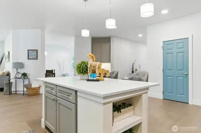 This view shows you the entrance to the dining area, hallway and informal living area to the left.  Notice the nice built in office nook straight back off the kitchen.