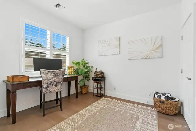 This bedroom/office is in front of the home just to the left of the entryway.