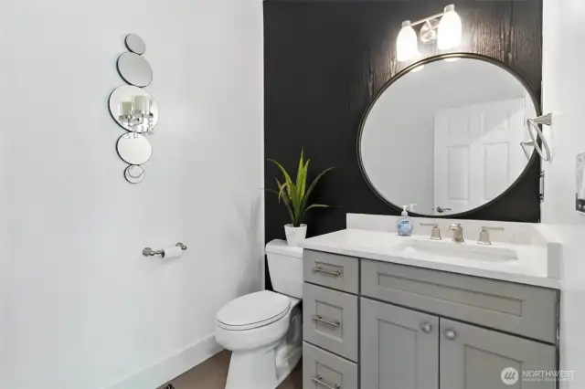 Just off the hallway in the entry, you'll find this lovely powder room for your guests!