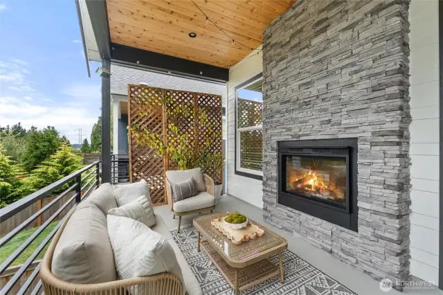 Outdoor covered deck with fireplace