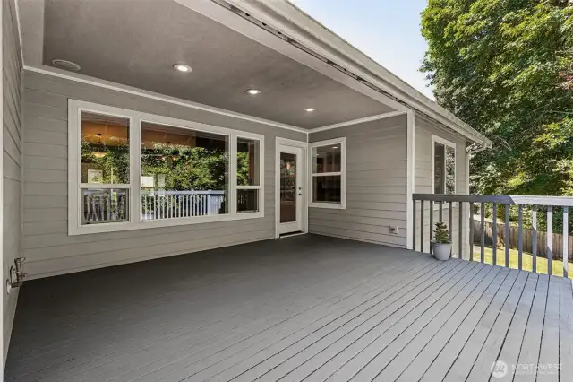 Private deck overlooking landscaped backyard