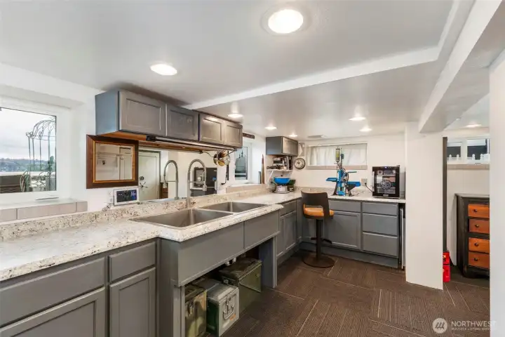 Shop in the basement with a wonderful view of the water and boat traffic and the windows open to so you can enjoy the sea breeze.