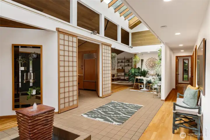 Stylish, authentic mid-century details are visible throughout: rich wood accents, clean lines, glass built-in shelves, vaulted ceilings, and shoji doors all showcase this beloved design style.