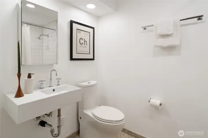Fourth bathroom on the lower level, also equipped with heated floors.