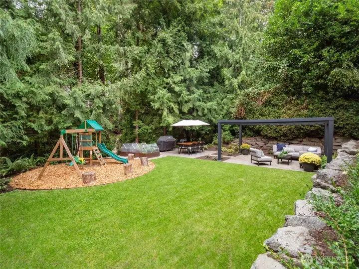 The backyard is your serene retreat on a shy half-acre, surrounded by trees in nearly every direction for unbelievable privacy