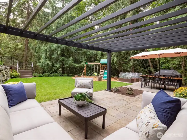 Relax under the pergola while taking in the sights and sounds of nature - you'll truly feel worlds away from it all!